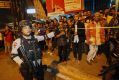 Police officers clear the scene after an explosion near a bus stop in the Kampung Melayu area of Jakarta.