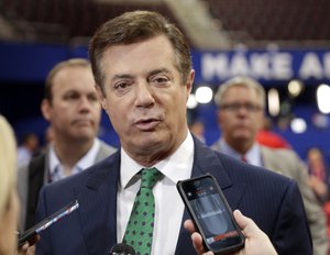 FILE - In this July 17, 2016 file photo, Trump Campaign Chairman Paul Manafort talks to reporters on the floor of the Republican National Convention at Quicken Loans Arena, Sunday, in Cleveland.