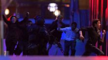 Hostages run from the Lindt cafe on the night of the siege.