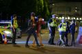 Concertgoers leave the Manchester Arena after the attack. 