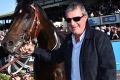 More bushie than city slicker: Darren Weir poses with High Church after winning the Warrnambool Cup on May 4.