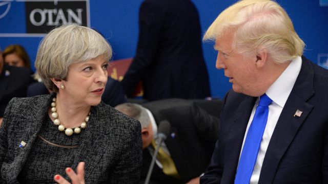 US President Donald Trump, right, speaks with British Prime Minister Theresa May.