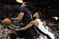 Houston Rockets centre Nene Hilario is fouled by San Antonio Spurs guard Patty Mills during game one of the western ...