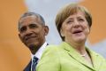 German Chancellor Angela Merkel and former US president  Barack Obama in Berlin on Thursday.