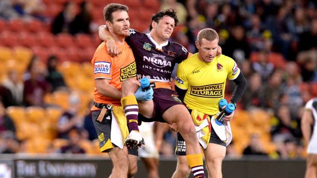 Clipped wings: Broncos paceman and Origin hopeful James Roberts is carried from the field after his leg collided with a ...