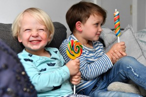 Brothers Sebastian, two, and Sam, three, enjoy a lollipop. 