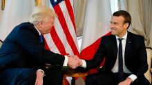 U.S. President Donald Trump shakes has with French President Emmanuel Macron at the top of a meeting at the U.S. ...