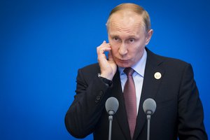 Russian President Vladimir Putin gestures while speaking to the media after the Belt and Road Forum at the China National Convention Center at the Yanqi Lake venue outskirt of Beijing in China, Monday, May 15, 2017.