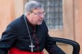 Cardinal George Pell arrives for a morning session of a synod on family issues at the Vatican in October, 2014.