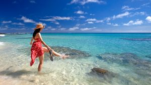 **IMAGES MUST CREDIT: yasawa island resort & spa. ***Woman kicking water at Yasawa. Supplied by Yasawa Island Resort & ...