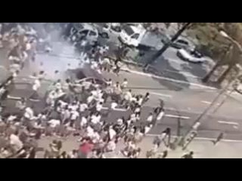 Car runs over crowd of student protesters in Guatemala