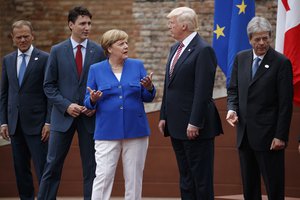 G7 leaders, from left, President of the European Commission Jean-Claude Junker, Canadian Prime Minister Justin Trudeau, German Chancellor Angela Merkel, President Donald Trump, and Italian Prime Minister Paolo Gentiloni, pose for a family photo at the Ancient Greek Theater of Taormina, Friday, May 26, 2017, in Taormina, Italy.