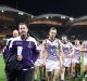 Ross Lyon leads the Dockers from the ground after their big loss.