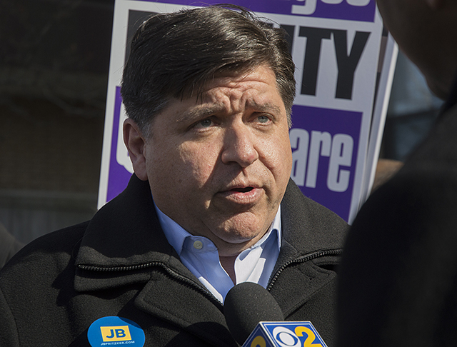 Gov. Candidate JB Pritzker Trolls Rauner With Giant Clock Mascot