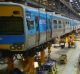 Workers at Downer's Newport workshop, where high-capacity trains will be built.  