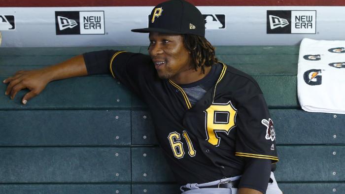 FILE - In this May 12, 2017 file photo, Pittsburgh Pirates' Gift Ngoepe, of South Africa, sits in the dugout prior to a baseball game against the Arizona Diamondbacks in Phoenix. Ngoepe made history on April 26 when he became the first African to play Major League Baseball. (AP Photo/Ross D. Franklin)