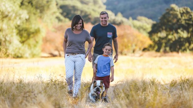 Mark Lukach, Giulia, their son Jonas, and bulldog, Goose, in a park in San Francisco last September. 