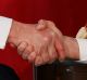 President Donald Trump shakes hands with French President Emmanuel Macron during a meeting at the U.S. Embassy, ...