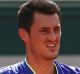 PARIS, FRANCE - MAY 28: Bernard Tomic of Australia reacts during the mens singles first round match against Dominic ...