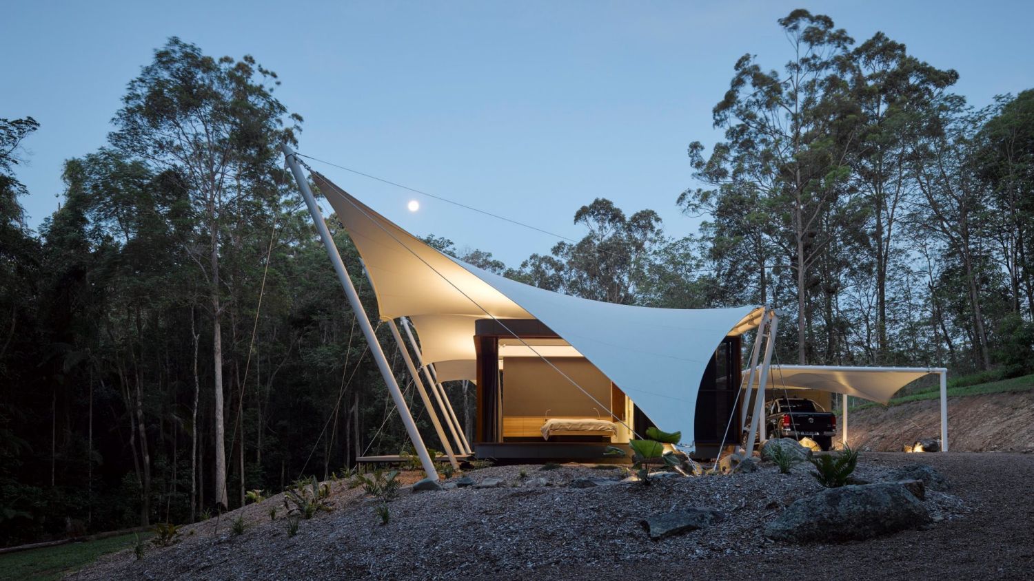 The tent house, which sits beneath dramatic sail-like structures at the edge of dense rainforest near Doonan, has earned Sparks Architects the Regional Project of the Year award at the 2017 Sunshine Coast Regional Architecture Awards.