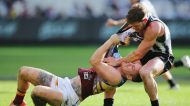 MELBOURNE, AUSTRALIA - MAY 28:  Taylor Adams of the Magpies wrestles on top of Dayne Beams of the Lions during the round ...