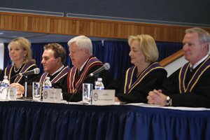 In this photo made on Thursday, Jan. 7, 2016, Pennsylvania Supreme Court Justices Christine Donohue, left, Max Baer, center left, Chief Justice Thomas G. Saylor, center, Debra Todd, center right, and Kevin M. Doughtery, right, sit at the dais during the swearing in ceremony for fellow Justice David N. Wecht at Duquesne University in Pittsburgh.