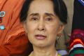 Myanmar's President Htin Kyaw, right, speaks to State Counsellor Aung San Suu Kyi, centre, and Myanmar's Vice President ...