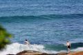 Swimmers take advantage of warmer weather at Cronulla.