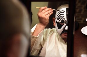 In this Saturday, May 13, 2017, photo, Zhao Hailong puts on makeup for his lead role in the Peking Opera classic ...