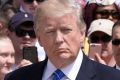 US President Donald Trump participates in a wreath laying ceremony near the Tomb of the Unknown Soldier at Arlington ...