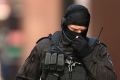 SYDNEY, AUSTRALIA - DECEMBER 15: Tactical Police are seen at the siege at Lindt Cafe in Martin Place on December 15, ...