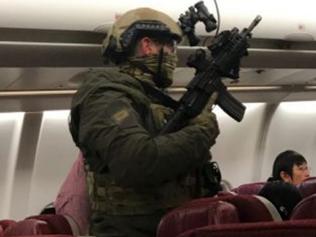 A MALAYSIA Airlines flight was grounded in Melbourne on Wednesday night after a “lunatic” passenger tried to storm the cockpit and threatened to blow up the plane. The Kuala Lumpur-bound plane was forced to turn back to Melbourne’s Tullamarine Airport half an hour after takeoff when a man, who was allegedly drunk or under the influence of drugs, tried to storm the cockpit. Picture: Andrew Leoncelli