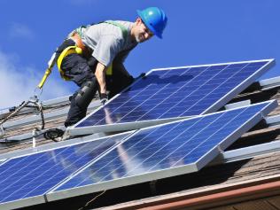 A man install solar panels. Solar panel installation.