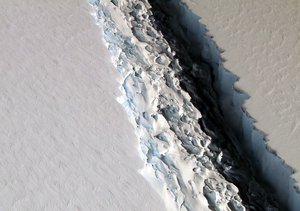 File - On Nov. 10, 2016, scientists on NASA's IceBridge mission photographed an oblique view of a massive rift in the Antarctic Peninsula's Larsen C ice shelf.