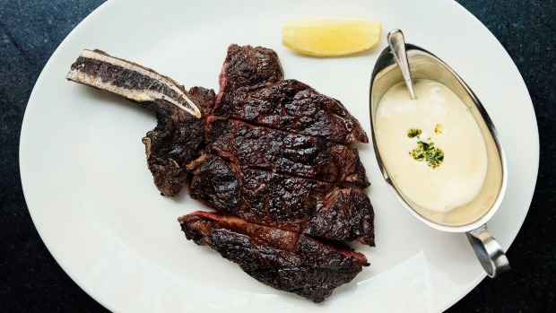 Rib-eye on the bone at Rockpool Bar and Grill restaurant in Sydney.