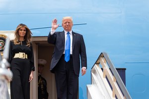 File - President Donald Trump waves as he and First Lady Melania Trump arrive, Saturday, May 20, 2017, to King Khalid International Airport in Riyadh, Saudi Arabia.