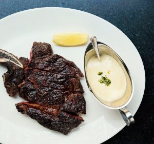 Rib-eye on the bone at Rockpool Bar and Grill restaurant in Sydney.