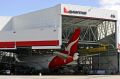 A fourth terminal at the airport will be built on what is now the Qantas jet base.