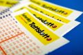 Tatts has won the right to run Victoria's lotteries.