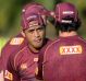 Master and apprentice: Anthony Milford talks to Johnathan Thurston at Queensland training.