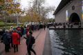 Crowds wait outside the NGV.
