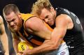 Port's Jack Hombsch stymies Hawks skipper Jarryd Roughead.