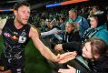 Fans help Brad Ebert mark his 200th game afer the win against Hawthorn. The players are in the game for love and the ...