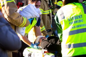 Passengers of the tram are treated by paramedics.