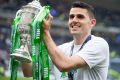 Hero: Tom Rogic lifts the Scottish Cup after scoring the injury-time winner for Celtic against Aberdeen.