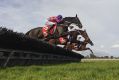 John Allen riding Renew (ctr) jumping before winning Race 4, The Australian Hurdle during Melbourne Racing at Sandown ...