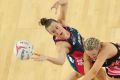 Emily Mannix of the Vixens and Sasha Glasgow of the Thunderbirds compete for the ball at Margaret Court Arena last round.