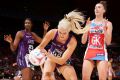 Towering threat: Gretel Tippett of the Firebirds takes possession.