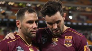 Tough night: Cameron Smith and Aidan Guerra look disconsolate after Queensland's humbling night.