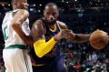 Cleveland Cavaliers forward LeBron James, right, drives against Boston Celtics guard Avery Bradley during the second ...